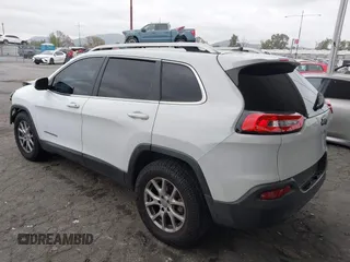 2015 Jeep Cherokee Latitude with VIN 1C4PJLCB5FW642701, listed as a IAAI auction lot 42063262 with 142,501 mi miles and . Bid and sale history available at carsss.com. Image 3.