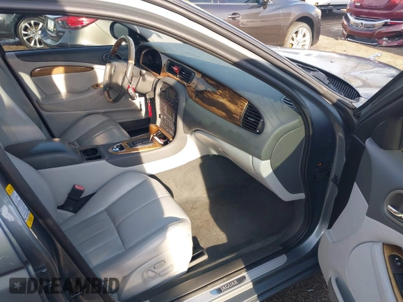 2003 Jaguar S-Type with VIN SAJEA01T23FM93839, listed as a IAAI auction lot 41891973 with 153,761 mi miles and . Bid and sale history available at DreamBid. Image 5.