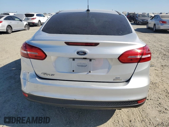 2018 Ford Focus SE with VIN 1FADP3FE4JL308909, listed as a Copart auction lot 61489005 with 58,613 mi miles and Salvage title. Bid and sale history available at DreamBid. Image 6.