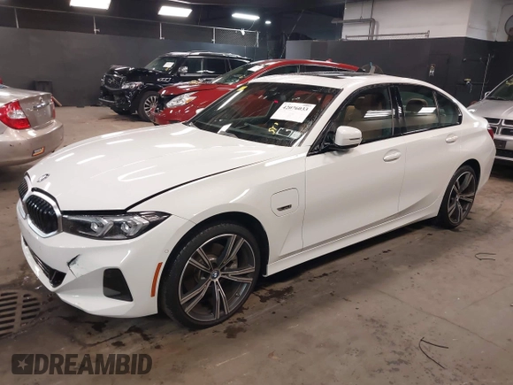 2023 BMW 3 Series 330e xDrive with VIN 3MW39FS05P8D20575, listed as a IAAI auction lot 42076033 with 10,875 mi miles. Bid and sale history available at carsss.com. Image 2.