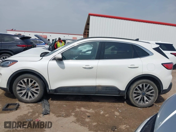 2020 Ford Escape Titanium Hybrid with VIN 1FMCU0DZ9LUA54867, listed as a IAAI auction lot 42268245 with 68,974 mi miles and . Bid and sale history available at DreamBid. Image 14.