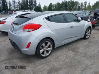2014 Hyundai Veloster RE:FLEX z VIN KMHTC6AD6EU217282, wystawiony jako IAAI lot #42334268 z przebiegiem 68 473 mil mil oraz . Historia ofert i sprzedaży dostępna na DreamBid. Obrazek 4.