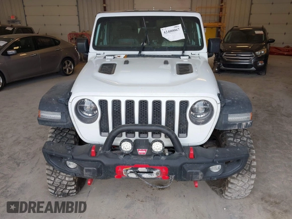 2022 Jeep Wrangler Unlimited Rubicon with VIN 1C4JJXFM0NW154202, listed as a IAAI auction lot 42400067 with 60,486 mi miles and . Bid and sale history available at DreamBid. Image 6.