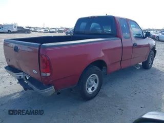 2000 Ford F-150 XL with VIN 1FTZX1729YNC32076, listed as a IAAI auction lot 41523364 with 216,726 mi miles. Bid and sale history available at carsss.com. Image 4.