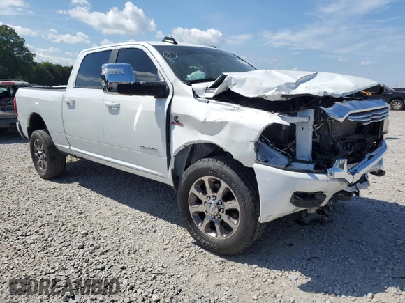 2023 Ram 2500 Laramie with VIN 3C6UR5FL2PG514919, listed as a Copart auction lot 59411155 with 23,679 mi miles and Salvage title. Bid and sale history available at DreamBid. Image 4.
