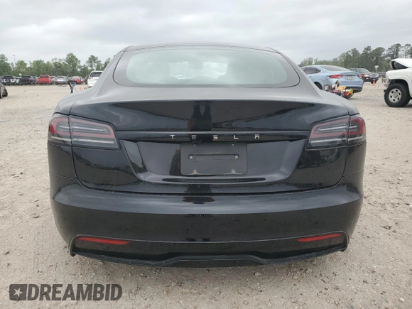 2023 Tesla Model S z VIN 5YJSA1E58PF531166, wystawiony jako Copart lot #51827565 z przebiegiem Nie podano mil oraz Szkoda całkowita • Salvage title. Historia ofert i sprzedaży dostępna na DreamBid. Obrazek 6.