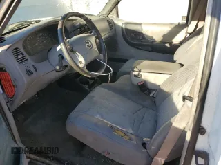 2001 Mazda B-Series 2WD Truck DS with VIN 4F4YR12U41TM25842, listed as a Copart auction lot 76827864 with 252,323 mi miles and Salvage Title. Bid and sale history available at carsss.com. Image 7.