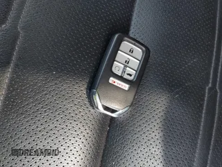2020 Honda CR-V Touring z VIN 2HKRW2H9XLH623380, wystawiony jako IAAI lot #42039028 z przebiegiem 59 795 mil mil oraz . Historia ofert i sprzedaży dostępna na DreamBid. Obrazek 11.
