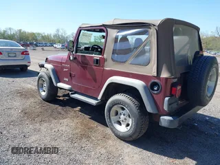 2002 Jeep Wrangler Sport with VIN 1J4FA49SX2P713303, listed as a IAAI auction lot 42136848 with 152,822 mi miles. Bid and sale history available at carsss.com. Image 3.