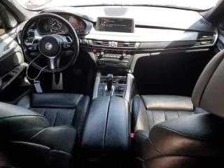 2014 BMW X5 xDrive50i with VIN 5UXKR6C54E0J72983, listed as a Copart auction lot 51047625 with 100,692 mi miles and Salvage Title. Bid and sale history available at carsss.com. Image 8.
