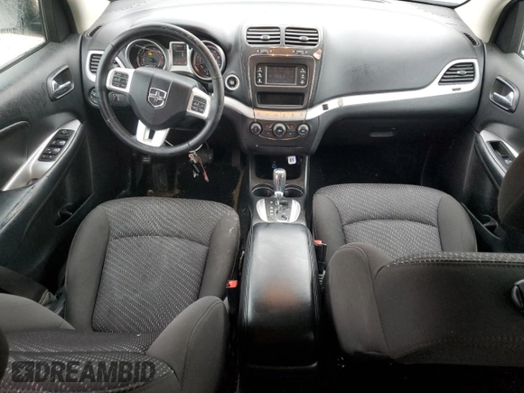 2017 Dodge Journey SXT with VIN 3C4PDCBB0HT545567, listed as a Copart auction lot 57766105 with 56,569 mi miles and Salvage title. Bid and sale history available at DreamBid. Image 8.