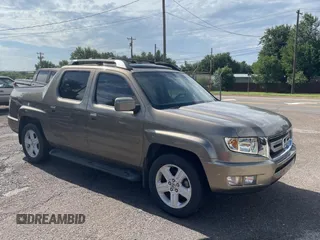 2009 Honda Ridgeline RTL with VIN 2HJYK16539H500759, listed as a Copart auction lot 63874225 with 123,508 mi miles and Clean title. Bid and sale history available at DreamBid. Image 1.