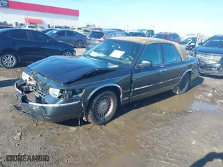 1999 Mercury Grand Marquis LS with VIN 2MEFM75W2XX641598, listed as a IAAI auction lot 41112721 with 152,801 mi miles. Bid and sale history available at carsss.com. Image 22.