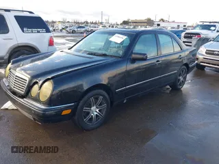 1997 Mercedes-Benz E-Class with VIN WDBJF72F1VA281514, listed as a IAAI auction lot 41586496 with 283,212 mi miles. Bid and sale history available at carsss.com. Image 2.