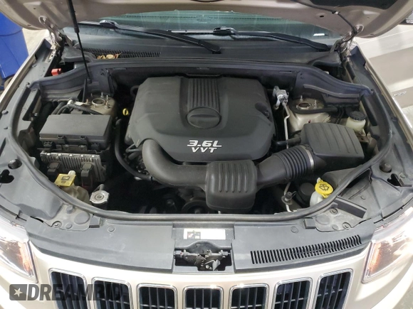 2014 Jeep Grand Cherokee Limited z VIN 1C4RJFBG1EC148908, wystawiony jako Copart lot #54311675 z przebiegiem 90 886 mil mil oraz Szkoda całkowita • Salvage title. Historia ofert i sprzedaży dostępna na DreamBid. Obrazek 12.