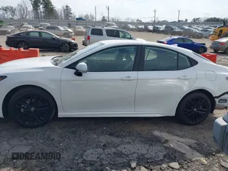 2025 Toyota Camry LE with VIN 4T1DAACK9SU084957, listed as a IAAI auction lot 41688859 with 7,396 mi miles and . Bid and sale history available at DreamBid. Image 14.
