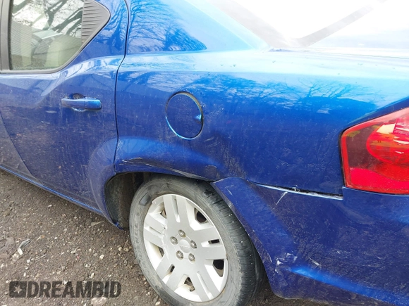 2013 Dodge Avenger SE with VIN 1C3CDZAB4DN628596, listed as a IAAI auction lot 41904599 with 56,791 mi miles and . Bid and sale history available at DreamBid. Image 13.