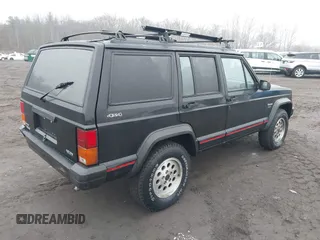 1995 Jeep Cherokee Sport with VIN 1J4FJ68S7SL572730, listed as a IAAI auction lot 41474520 with 189,907 mi miles. Bid and sale history available at carsss.com. Image 4.