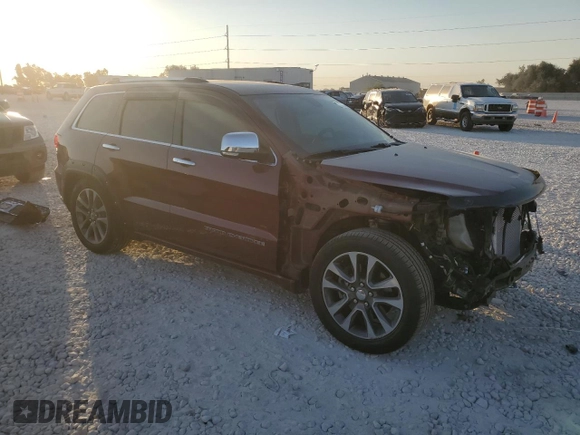 2018 Jeep Grand Cherokee Overland with VIN 1C4RJFCT3JC453784, listed as a Copart auction lot 71921944 with 56,097 mi miles and Salvage title. Bid and sale history available at DreamBid. Image 4.