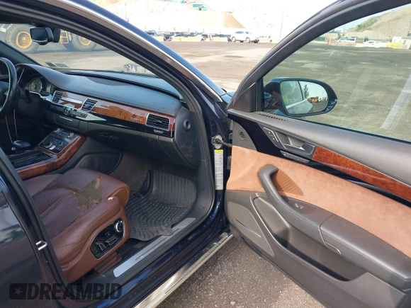 2011 Audi A8 with VIN WAURVAFD4BN018884, listed as a IAAI auction lot 42693000 with 116,952 mi miles and . Bid and sale history available at DreamBid. Image 5.