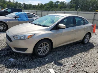 2018 Ford Focus SE z VIN 1FADP3F29JL201473, wystawiony jako Copart lot #69723354 z przebiegiem 94 329 mil mil oraz Szkody całkowita. Historia ofert i sprzedaży dostępna na DreamBid. Obrazek 1.