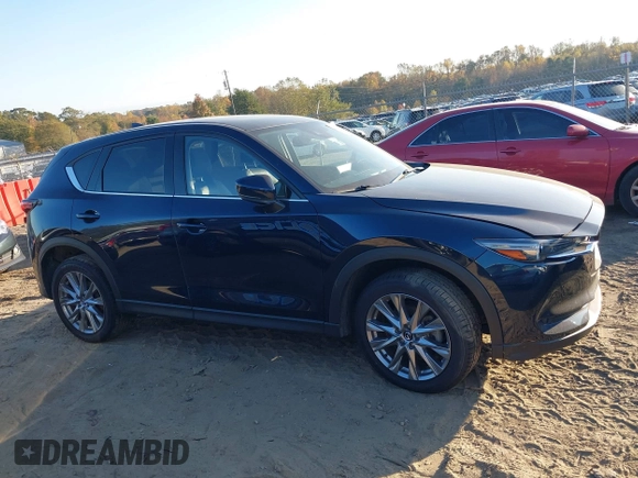 2021 Mazda CX-5 Grand Touring Reserve with VIN JM3KFBAYXM0465762, listed as a IAAI auction lot 40728368 with 30,667 mi miles. Bid and sale history available at carsss.com. Image 13.