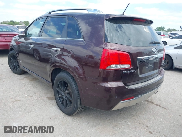 2012 Kia Sorento SX with VIN 5XYKWDA25CG249584, listed as a IAAI auction lot 42008349 with 214,381 mi miles. Bid and sale history available at carsss.com. Image 3.