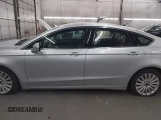 2013 Ford Fusion SE Hybrid with VIN 3FA6P0LU7DR228691, listed as a IAAI auction lot 42055540 with 144,389 mi miles and . Bid and sale history available at DreamBid. Image 14.