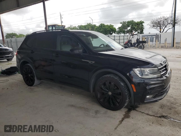 2021 Volkswagen Tiguan SE with VIN 3VV3B7AX4MM095257, listed as a Copart auction lot 60690015 with 61,782 mi miles and Salvage title. Bid and sale history available at DreamBid. Image 4.