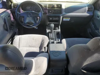 1999 Isuzu Rodeo S with VIN 4S2CK58WXX4373485, listed as a Copart auction lot 87804995 with 246,518 mi miles and Salvage title. Bid and sale history available at DreamBid. Image 8.