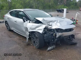 2016 Nissan Maxima SV z VIN 1N4AA6AP1GC904065, wystawiony jako IAAI lot #41930372 z przebiegiem 172 376 mil mil oraz . Historia ofert i sprzedaży dostępna na DreamBid. Obrazek 1.