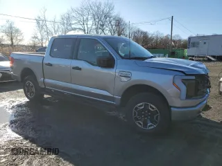 2023 Ford F-150 Lightning Pro with VIN 1FTVW1EL3PWG61686, listed as a Copart auction lot 49578085 with 8,116 mi miles and Salvage Title. Bid and sale history available at DreamBid. Image 4.