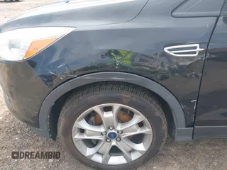 2014 Ford Escape Titanium with VIN 1FMCU0JX1EUD71953, listed as a IAAI auction lot 42036023 with 165,624 mi miles. Bid and sale history available at carsss.com. Image 14.