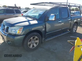 2004 Nissan Titan LE with VIN 1N6AA07A74N568235, listed as a IAAI auction lot 41713080 with 187,318 mi miles and . Bid and sale history available at DreamBid. Image 2.