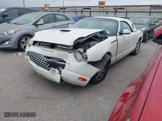 2002 Ford Thunderbird w/Hardtop Premium with VIN 1FAHP60A62Y127579, listed as a IAAI auction lot 42035019 with 98,582 mi miles. Bid and sale history available at carsss.com. Image 2.