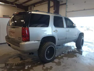 2012 GMC Yukon SLT with VIN 1GKS2CE03CR134986, listed as a IAAI auction lot 41352570 with 141,098 mi miles. Bid and sale history available at carsss.com. Image 4.