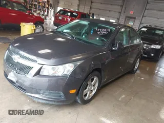 2014 Chevrolet Cruze 1LT with VIN 1G1PC5SBXE7477219, listed as a IAAI auction lot 41970786 with 194,542 mi miles and . Bid and sale history available at DreamBid. Image 2.