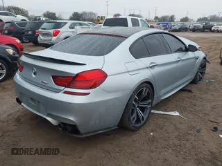 2014 BMW M6 z VIN WBS6C9C57ED467180, wystawiony jako IAAI lot #41461463 z przebiegiem 101 023 mil mil oraz . Historia ofert i sprzedaży dostępna na DreamBid. Obrazek 4.