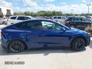 2023 Tesla Model Y Long Range with VIN 7SAYGDEE9PA205757, listed as a IAAI auction lot 41705881 with 18,567 mi miles and . Bid and sale history available at carsss.com. Image 13.