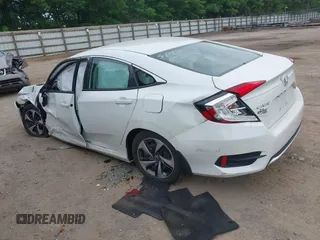 2020 Honda Civic LX z VIN 19XFC2F66LE021813, wystawiony jako IAAI lot #42285033 z przebiegiem 116 069 mil mil oraz . Historia ofert i sprzedaży dostępna na DreamBid. Obrazek 3.