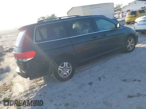 2010 Honda Odyssey Touring with VIN 5FNRL3H95AB031007, listed as a IAAI auction lot 41852435 with 207,919 mi miles. Bid and sale history available at carsss.com. Image 4.