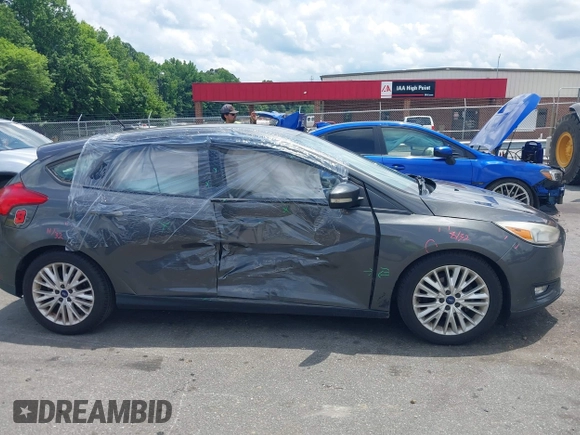 2016 Ford Focus Titanium with VIN 1FADP3N20GL275763, listed as a IAAI auction lot 42511959 with 124,891 mi miles and . Bid and sale history available at DreamBid. Image 13.