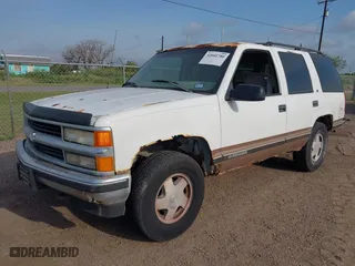 1997 Chevrolet Tahoe with VIN 1GNEK13R3VJ416827, listed as a IAAI auction lot 42041780 with 143,566 mi miles. Bid and sale history available at carsss.com. Image 2.