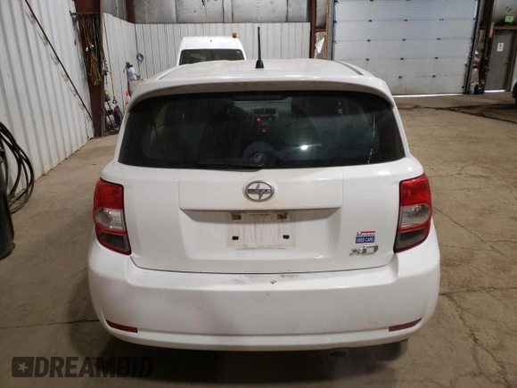 2014 Scion xD with VIN JTKKUPB48E1046627, listed as a Copart auction lot 61498995 with 63,452 mi miles and Salvage title. Bid and sale history available at DreamBid. Image 6.