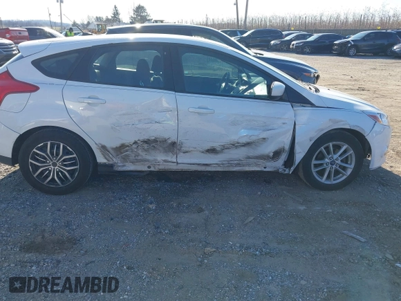 2012 Ford Focus SE z VIN 1FAHP3K29CL265135, wystawiony jako IAAI lot #40989480 z przebiegiem 158 742 mil mil oraz . Historia ofert i sprzedaży dostępna na DreamBid. Obrazek 6.