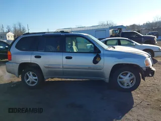 2005 GMC Envoy SLE with VIN 1GKDT13S452194933, listed as a IAAI auction lot 41426512 with 176,897 mi miles. Bid and sale history available at carsss.com. Image 13.