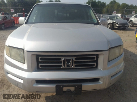 2007 Honda Ridgeline RTL z VIN 2HJYK16537H501200, wystawiony jako IAAI lot #42425662 z przebiegiem 188 618 mil mil oraz . Historia ofert i sprzedaży dostępna na DreamBid. Obrazek 13.
