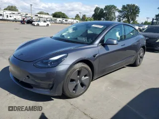 2023 Tesla Model 3 with VIN 5YJ3E1EA0PF711084, listed as a Copart auction lot 56558265 with 22,079 mi miles and Salvage title. Bid and sale history available at DreamBid. Image 1.