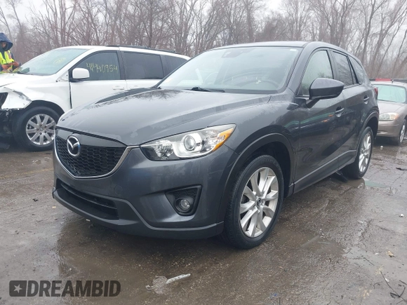 2014 Mazda CX-5 Grand Touring with VIN JM3KE4DY0E0392476, listed as a IAAI auction lot 41419144 with 89,245 mi miles and . Bid and sale history available at carsss.com. Image 2.
