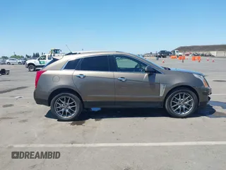 2015 Cadillac SRX Performance Collection with VIN 3GYFNFE35FS569682, listed as a IAAI auction lot 42322229 with 124,365 mi miles and . Bid and sale history available at DreamBid. Image 13.